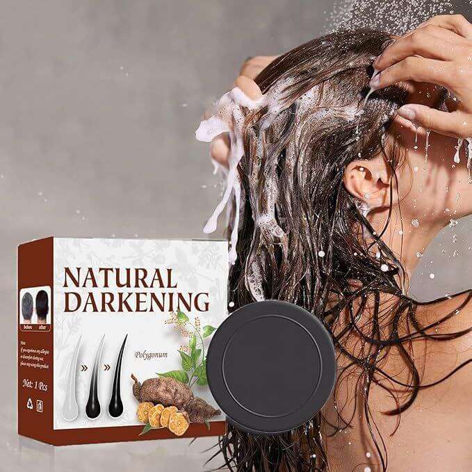 Woman washing hair with natural darkening shampoo bar made from organic ingredients and herbs