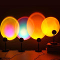 LED sunset projection lamps displaying colorful sunset light patterns on a wall with adjustable angles and heights.